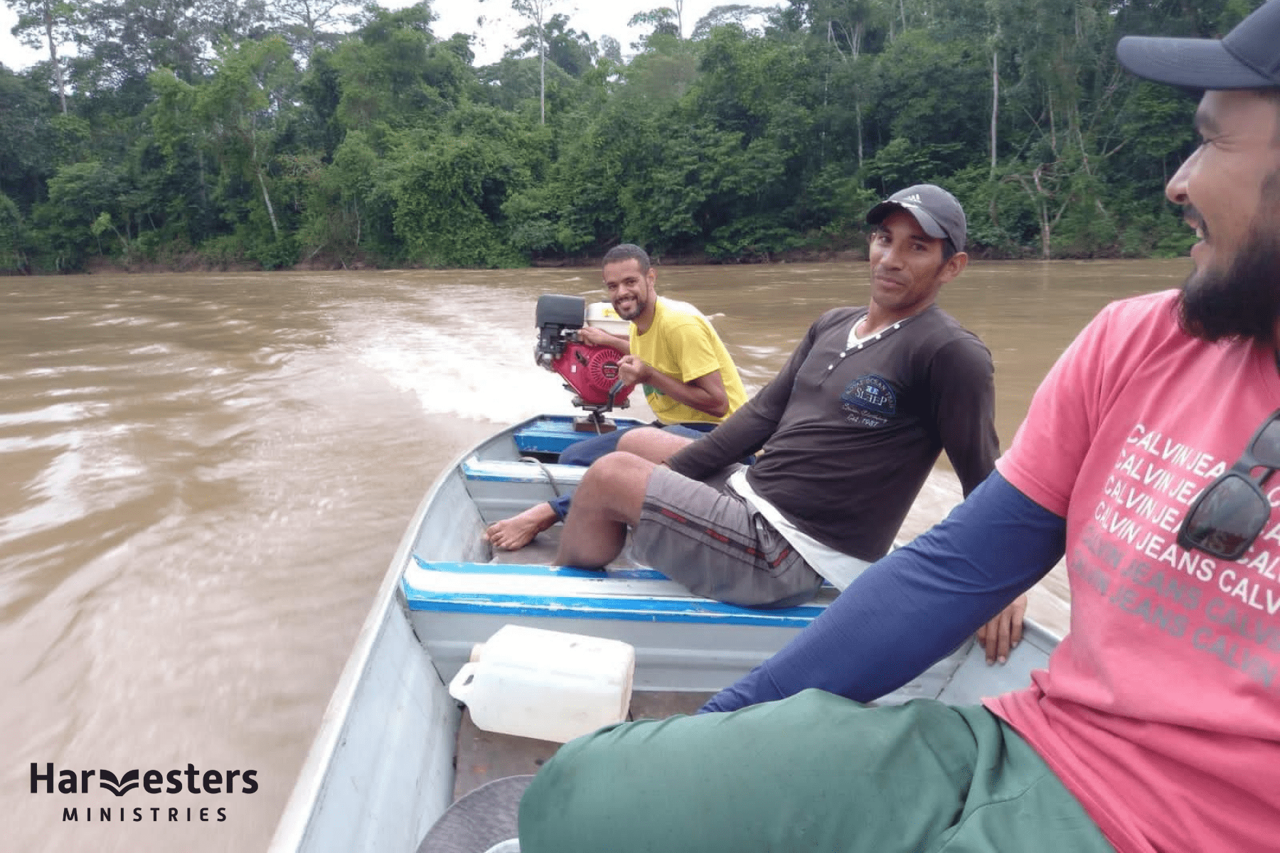 Ps Marcos (back) and fellow believers travelling the Amazon River. Harvesters Ministries.