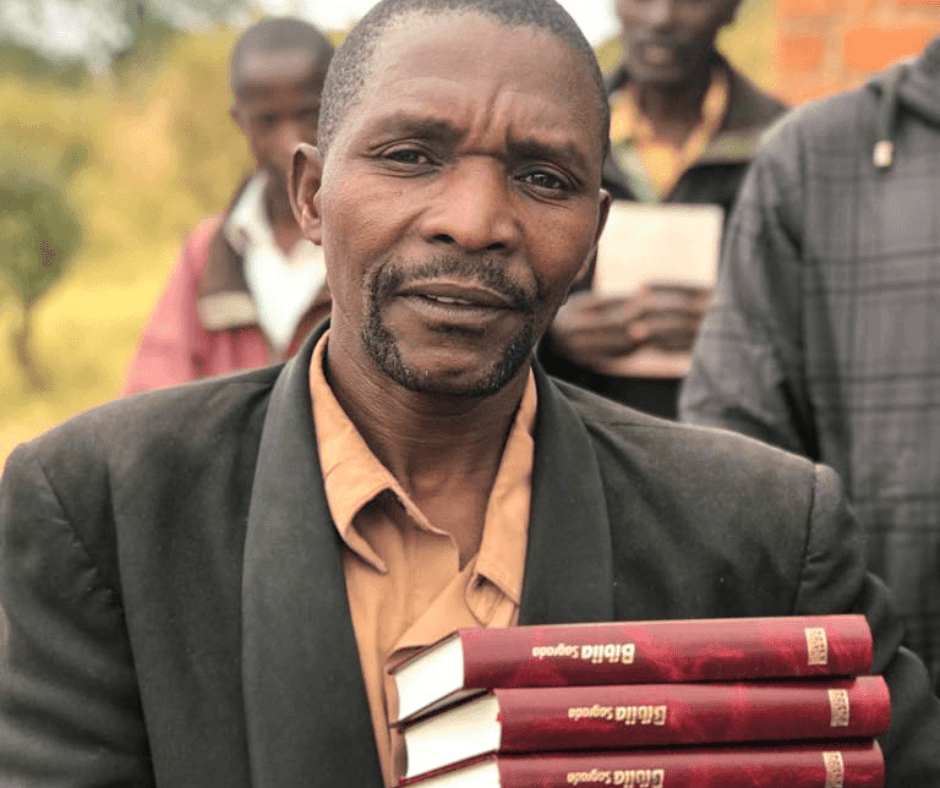 Man carrying Bibles