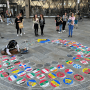 Street artist paints flags of Europe. Harvesters Ministries
