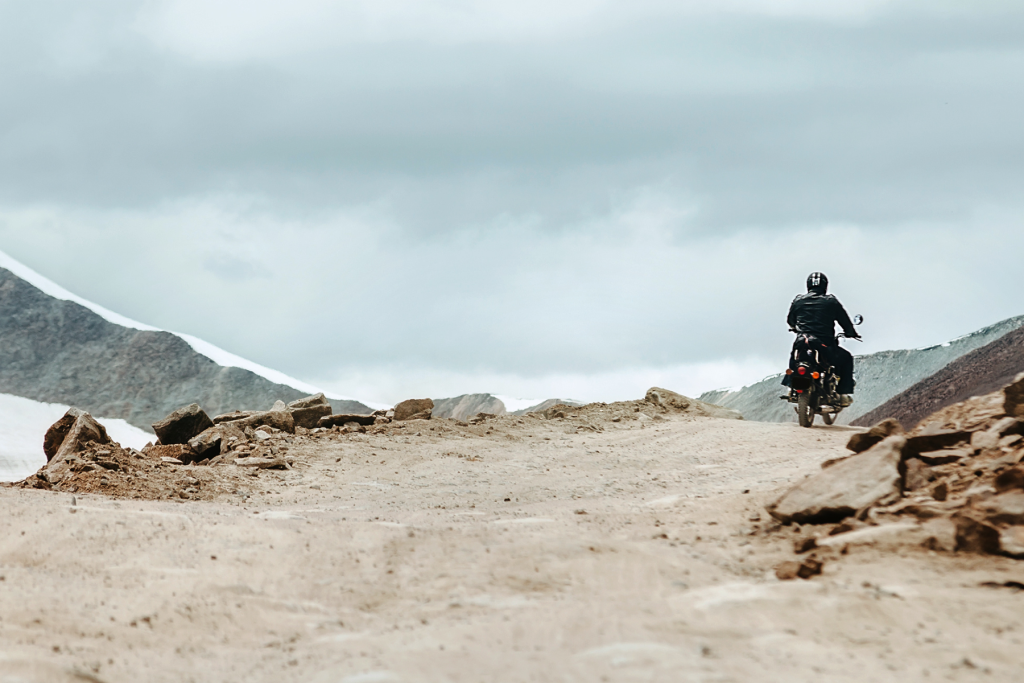 Man riding motorbike in mountains